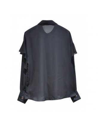 Black shirt with ruffles on the sleeves